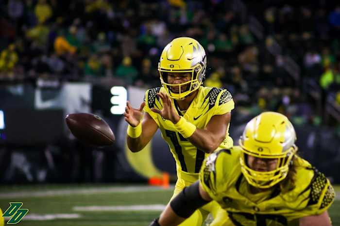 Thompson takes a snap against Stony Brook in his first collegiate action.